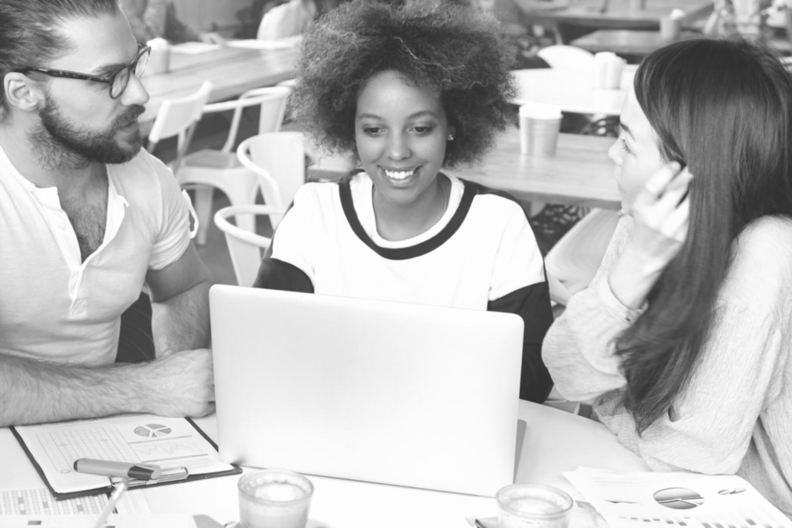 Professional woman reviewing financial documents at desk